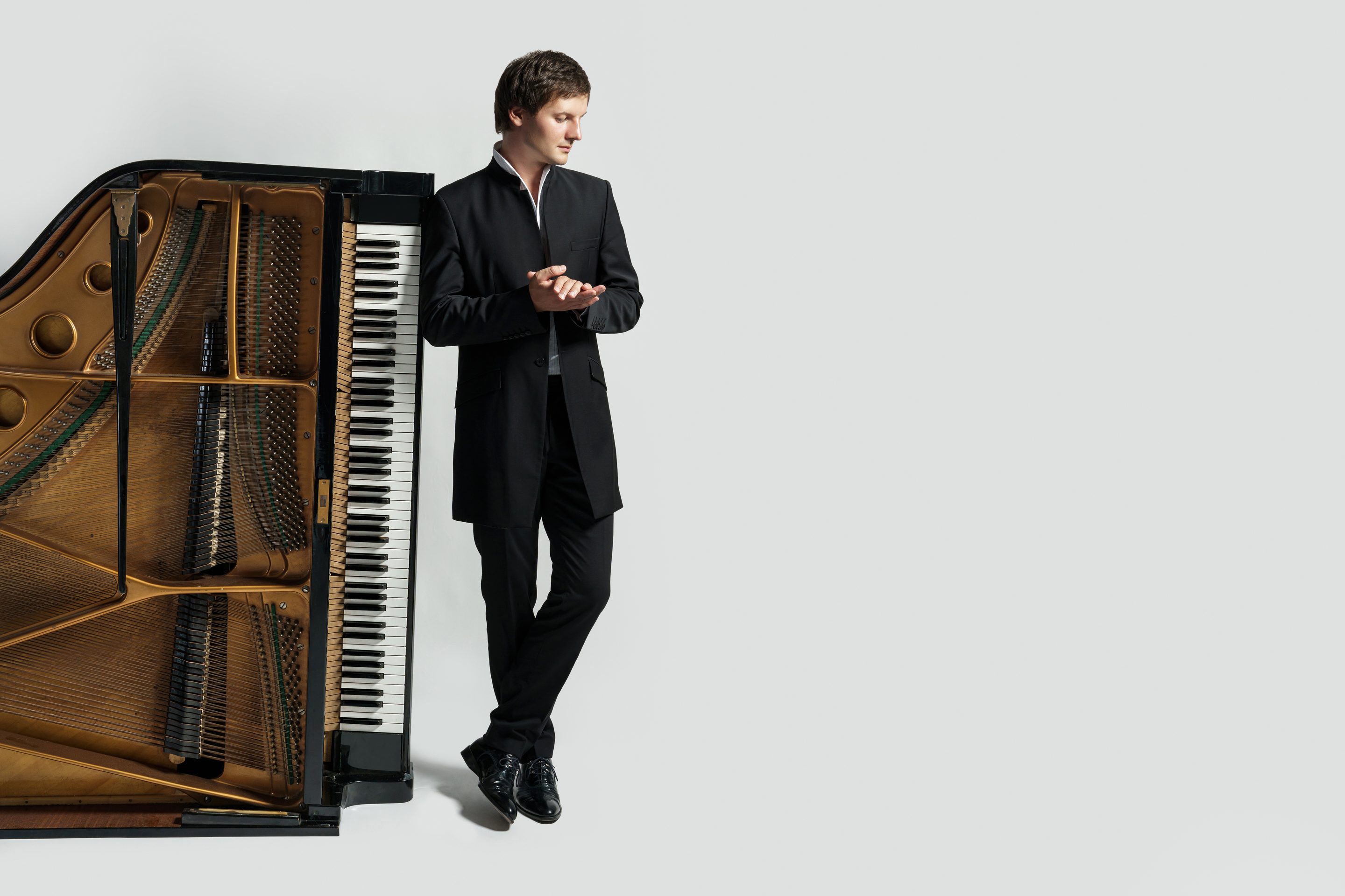 Gleb Koroleff beside the piano